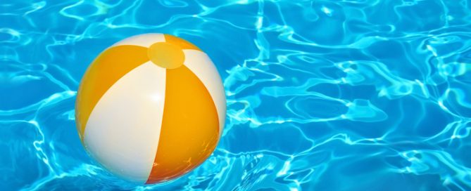 Ball in swimming pool water