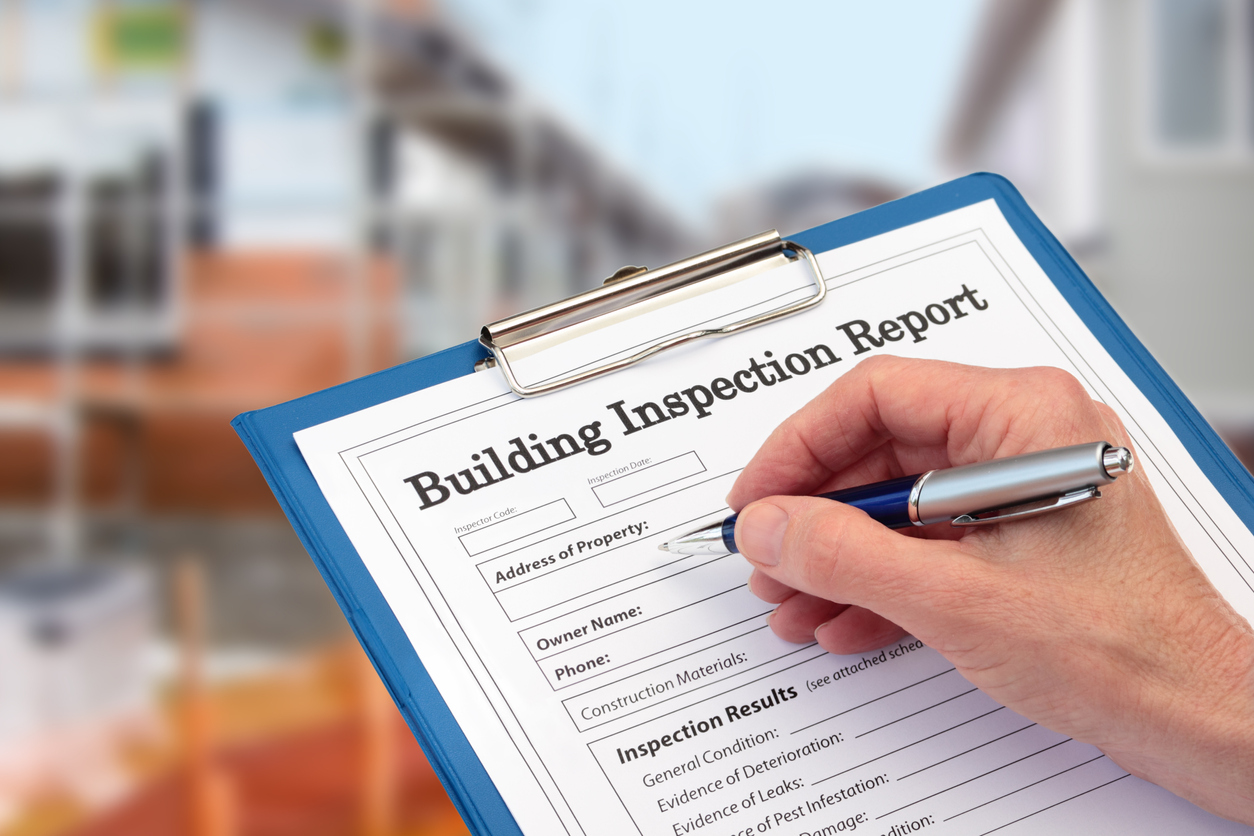 Buiding Inspector completing an inspection form